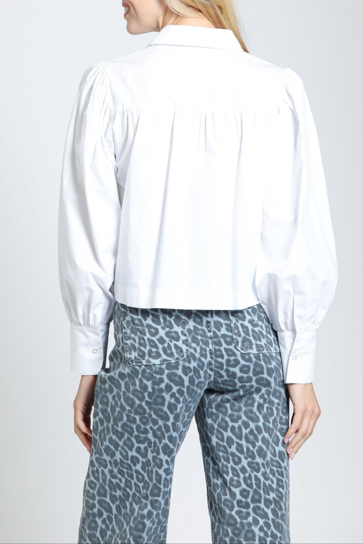 Side view of the APNY Puff Sleeve Shirt in White