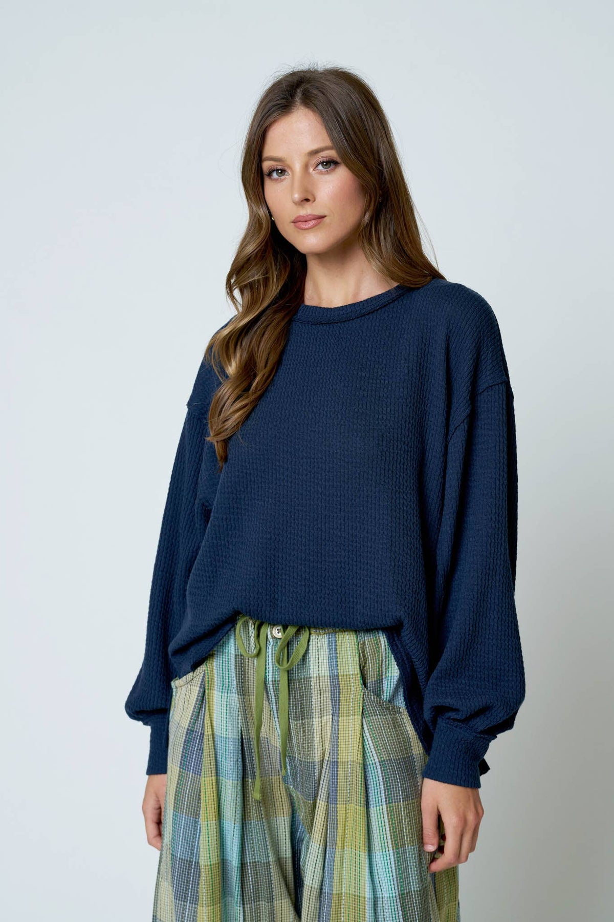 Blu Pepper Textured Exposed Seam Long Extended Sleeve Knit Top - Navy front view