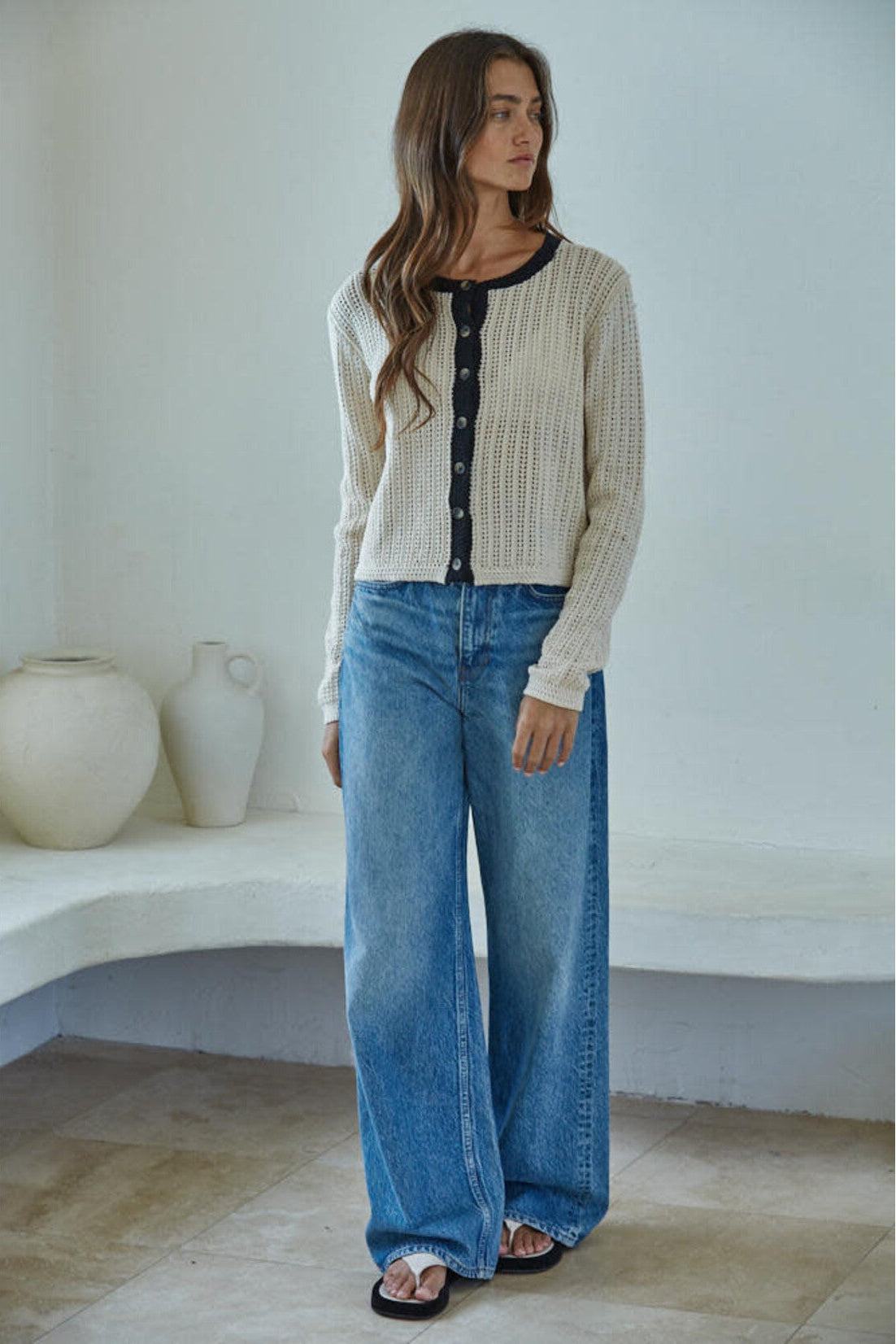 Side view of the By Together Huron Cardigan Top in Natural with black trim