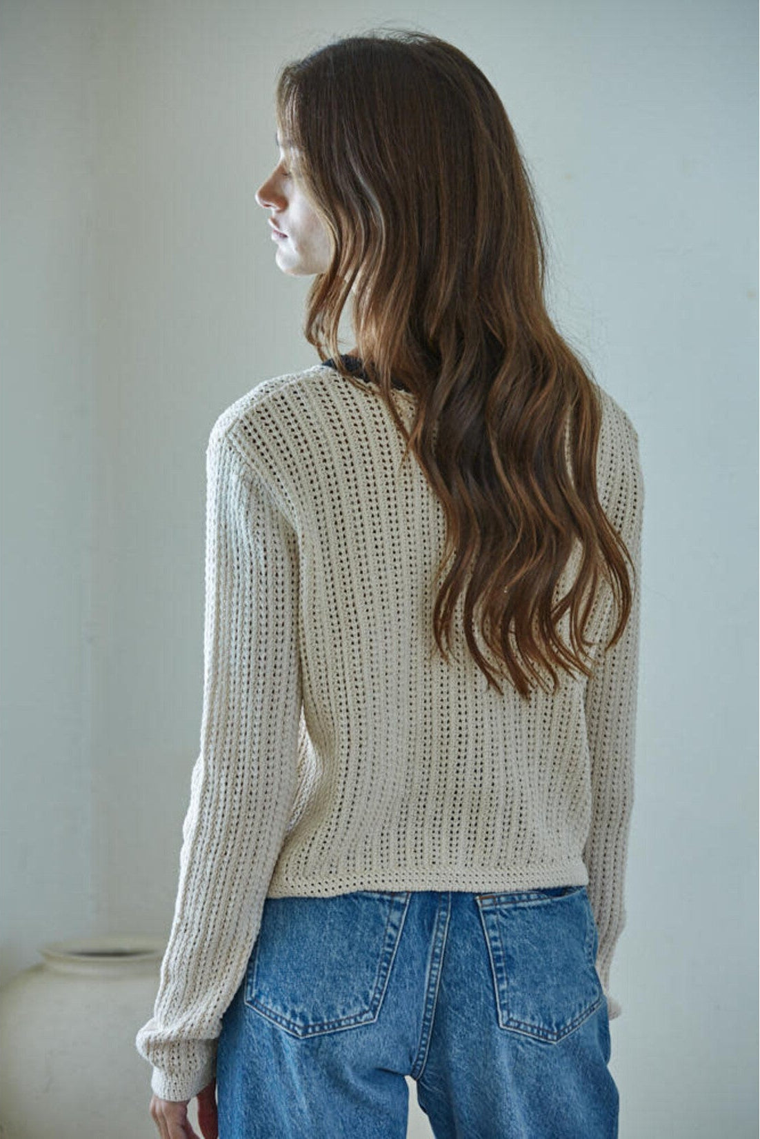Close-up of the black contrast trim on the By Together Huron Cardigan Top