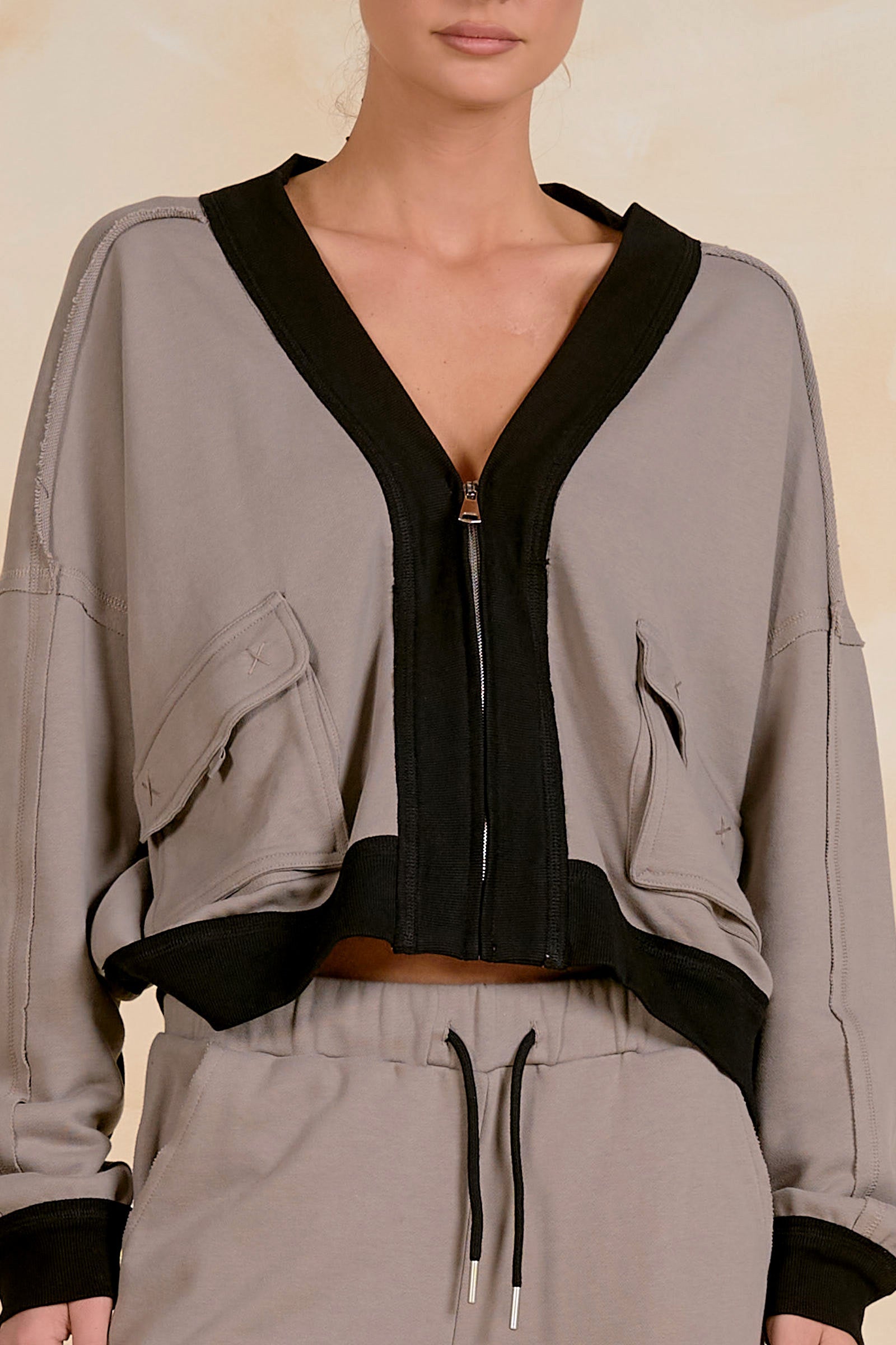 Close-up of the patch pocket and raw edge detail on the Elan Jacket W/Pocket