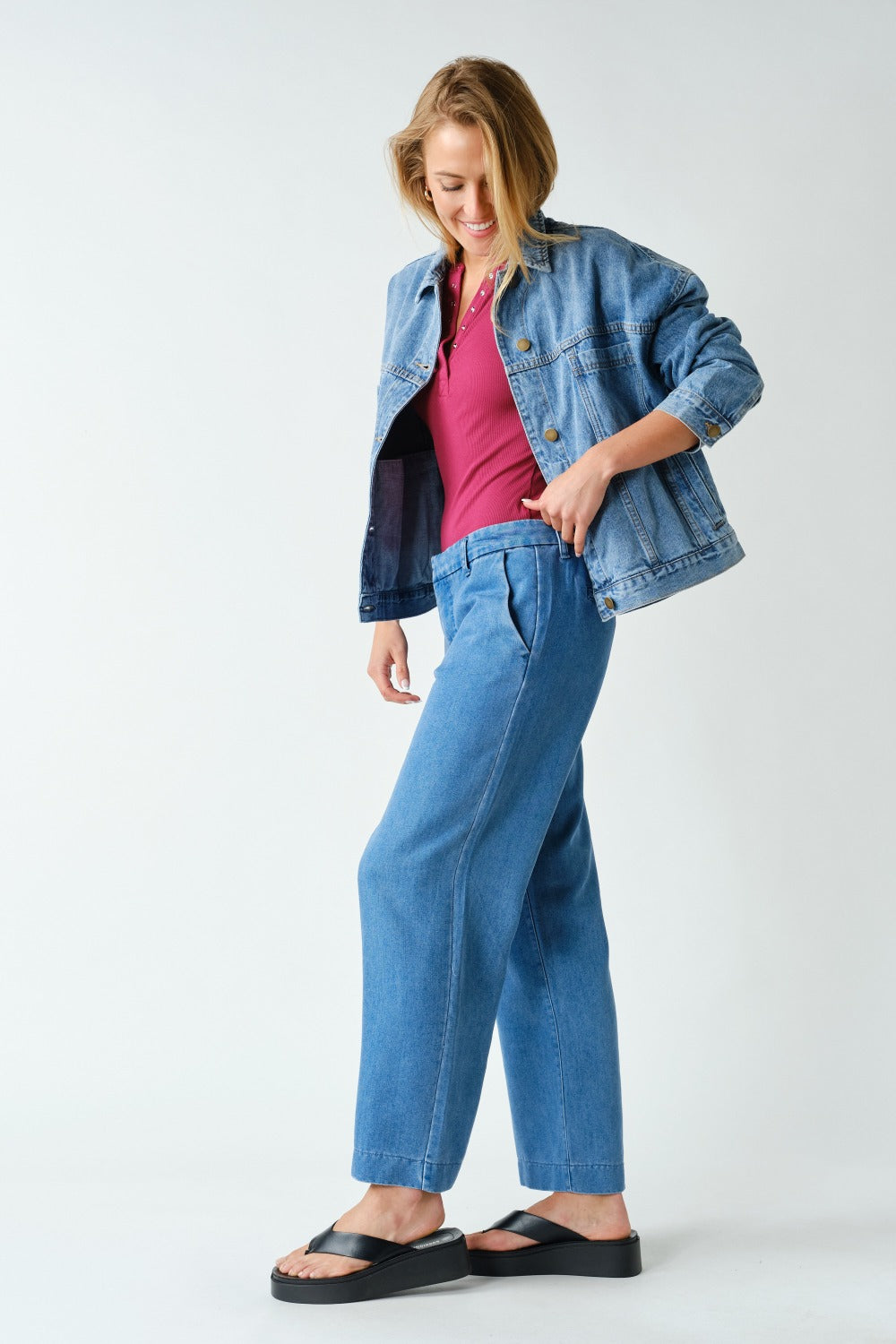 Back view of the Mono B Boxy Denim Trucker Jacket in Medium Denim.