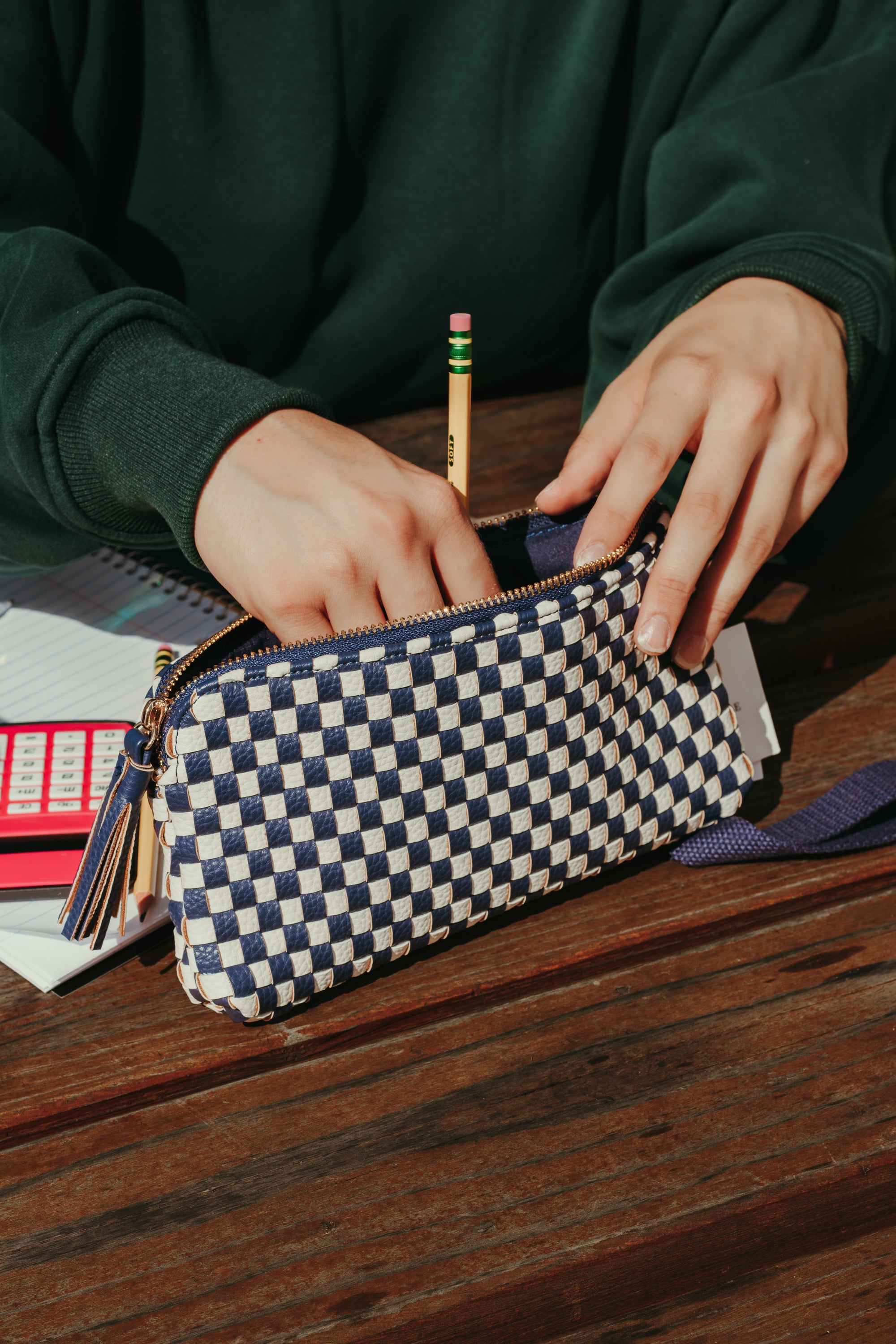 Front view of the Pretty Simple Emma Woven Clutch Wristlet in Navy Checkered.