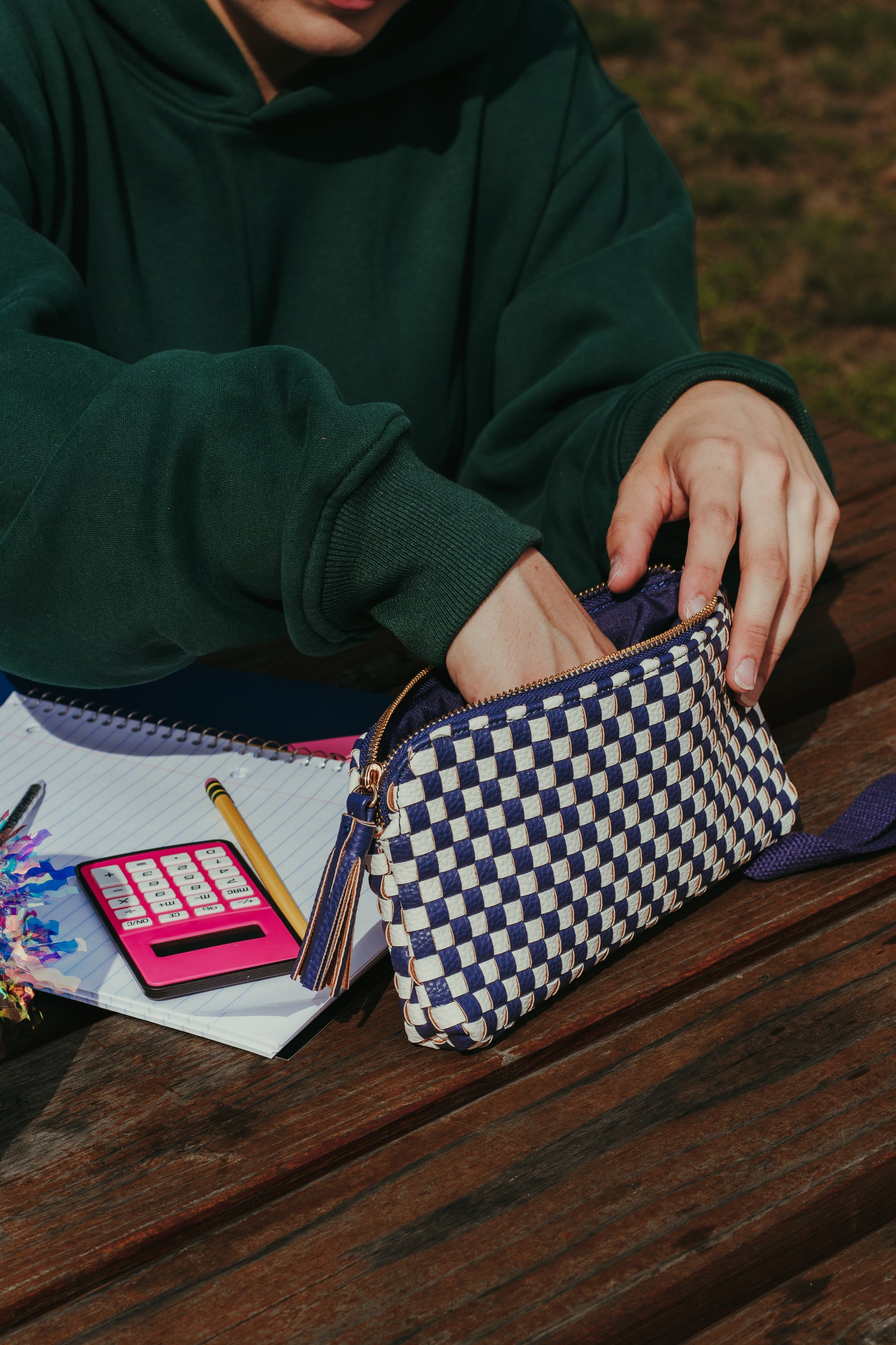 Interior view of the Pretty Simple Emma Woven Clutch Wristlet in Navy Checkered showing the card holder and wristlet strap.